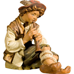 Pastor sentado con flauta